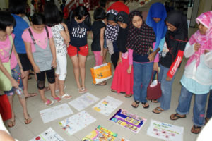 Fig. 3: Children peer-judging the work created for the poster competition.
Source: Arts-ED