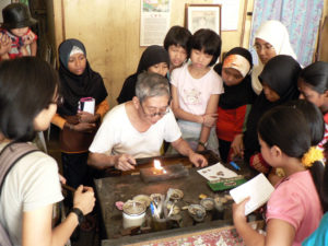 Fig. 4: Children observing the silversmith at work.
Source: Arts-ED